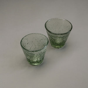 A set of 2 v-shaped glasses with a crackle finish.