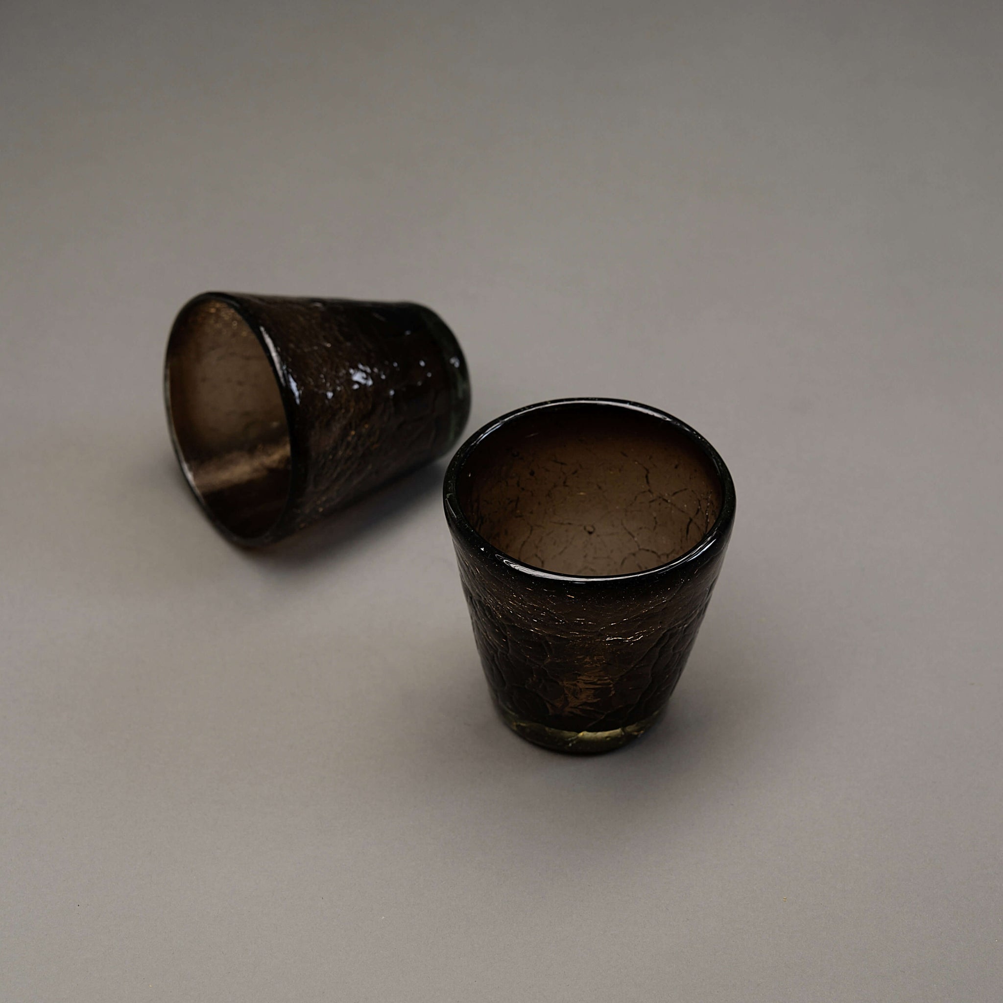 A set of 2 crinkly glasses with a v shape and a crackle finish.