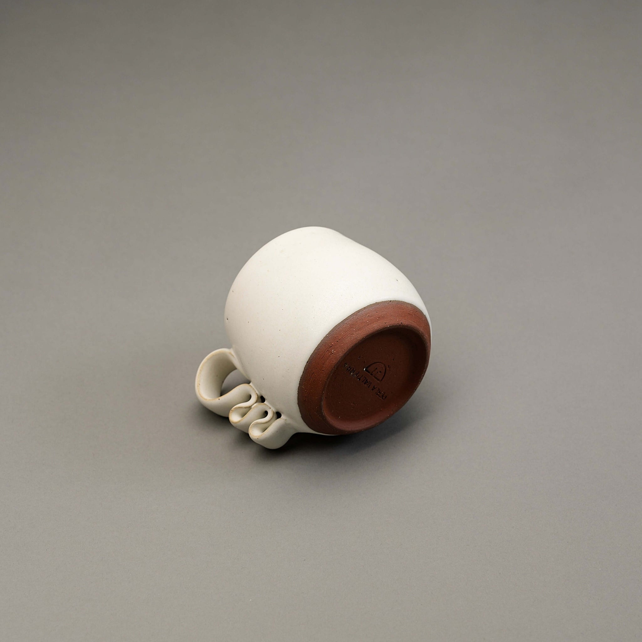 A ribete mug by Perla Valtierra in white glaze.