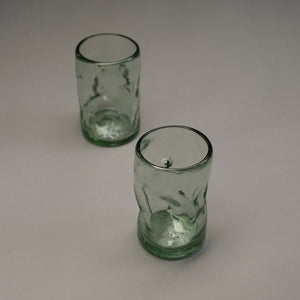 A set of 2 pinched mouthblown glass tumblers.