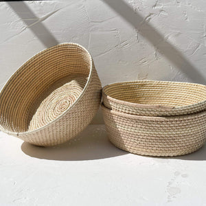 The handwoven details on a set of Baja palm baskets.