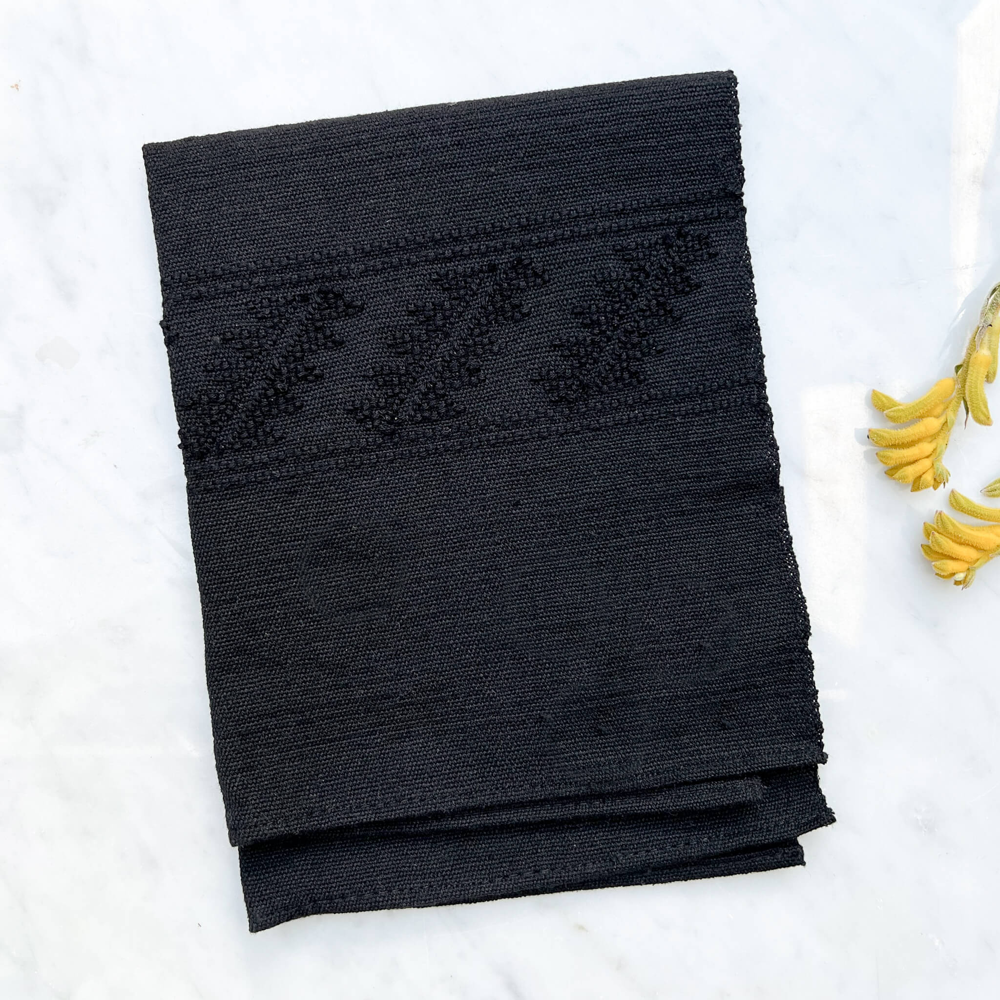 Black cotton napkin handmade in Oaxaca, Mexico.