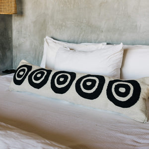The details on a circulo black and ivory lumbar pillow.