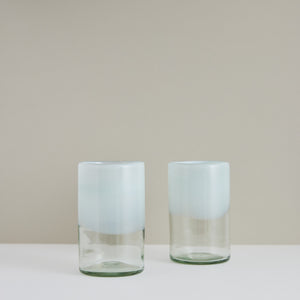 A pair of handblown white-dipped glass tumblers made in Mexico.