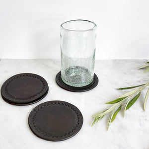 Javier leather coasters in black with a large Baja handblown glass tumbler.