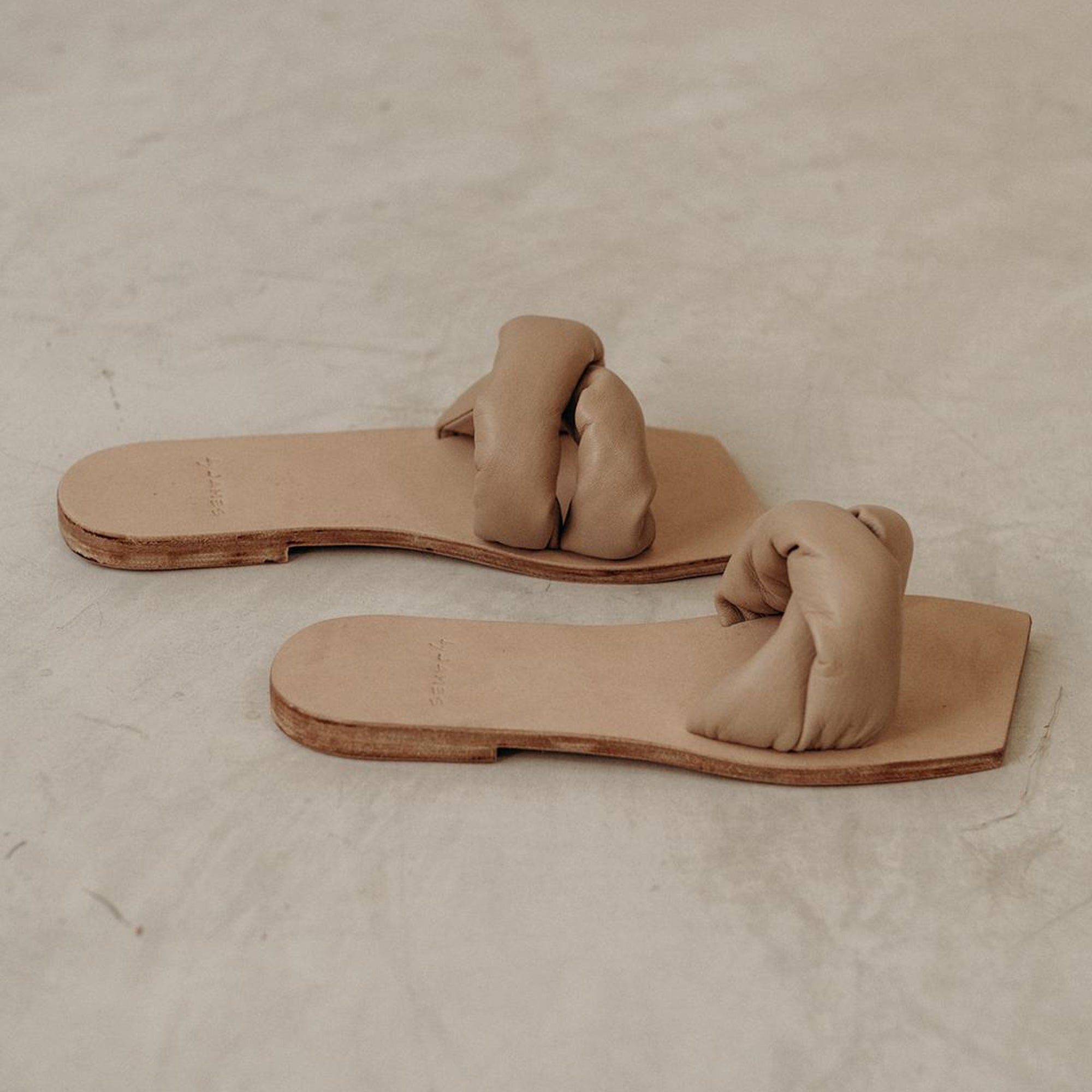 Padded leather sandals in nude made by James.