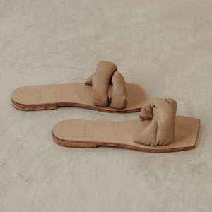 Padded leather sandals in nude made by James.