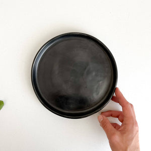 Oaxaca black clay 8" plate with a 1" rim.