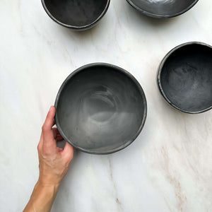 A Oaxaca black clay shallow serving bowl.
