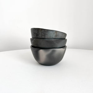 Stacked Oaxaca black clay bowls.