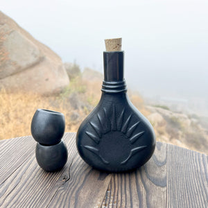 A Oaxaca black clay mezcal tasting vessel