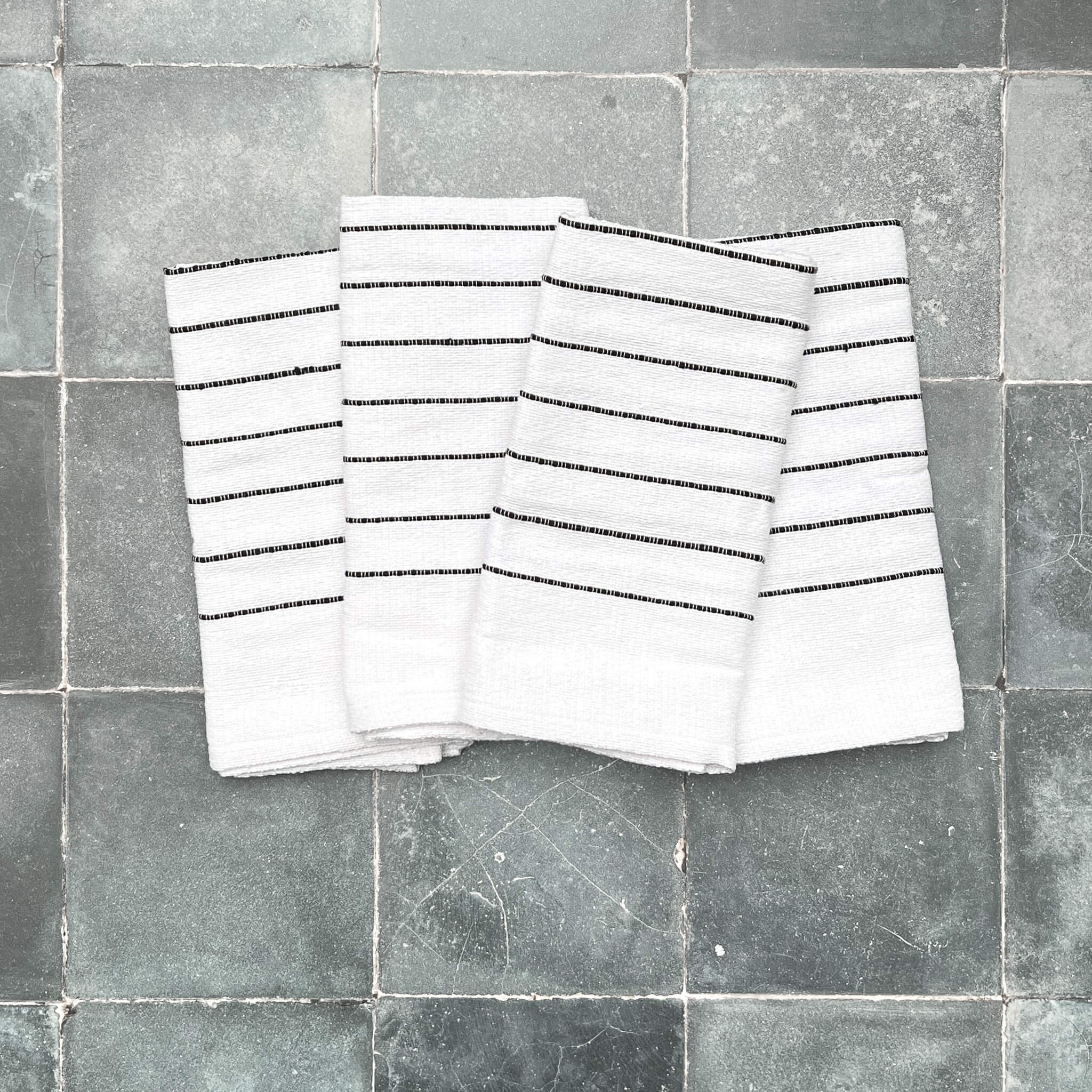 Set of four Oaxaca cotton napkins in black and white.
