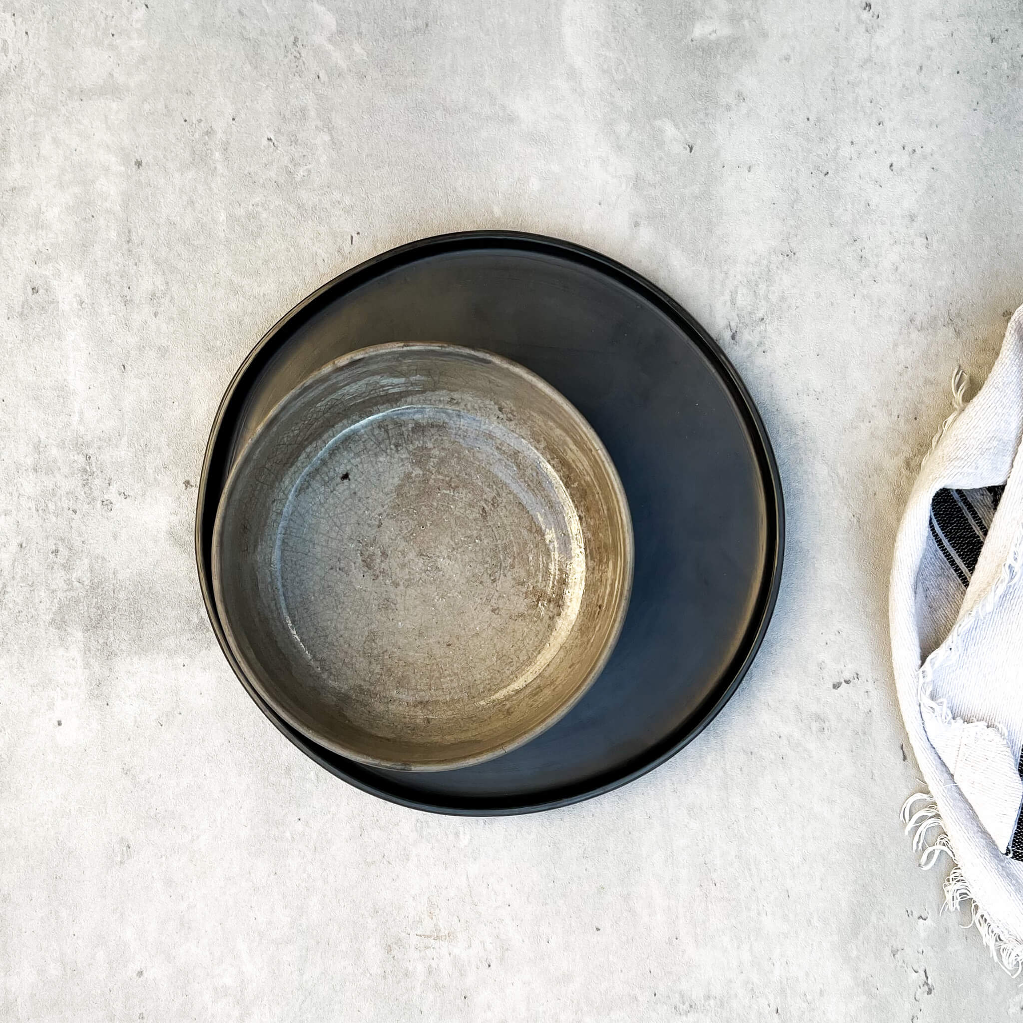 Oaxaca pottery, including a smoked clay bowl paired with a black clay salad plate.