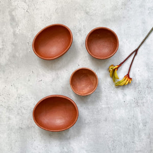 Oaxaca red clay bowls in various sizes.