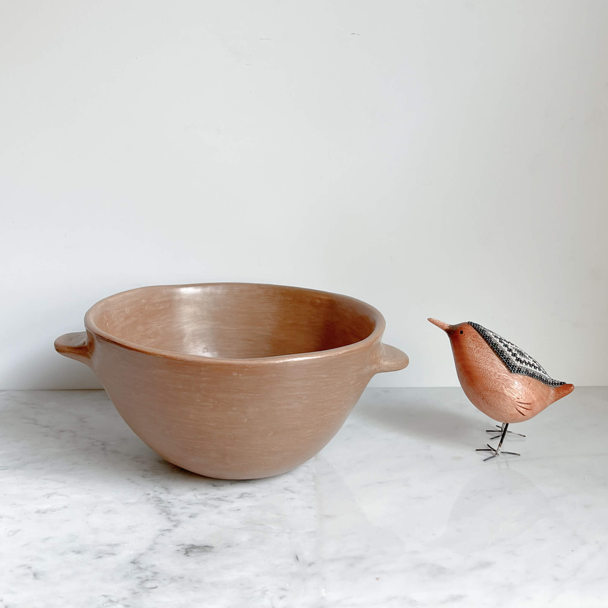 A large clay serving bowl made in Puebla, Mexico.