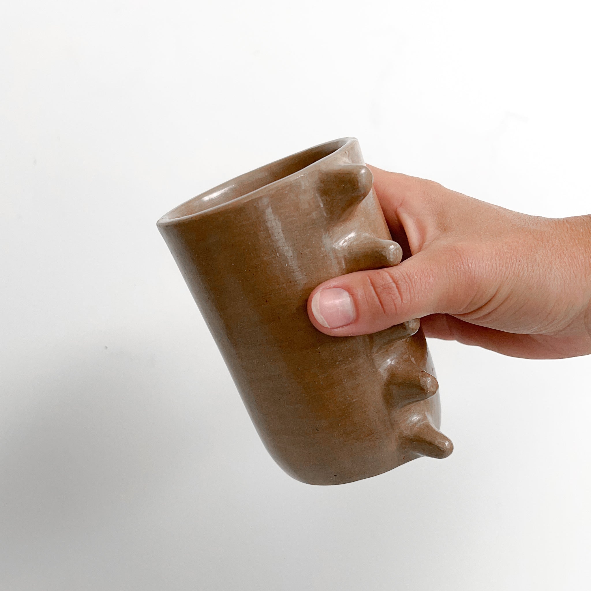 Spiky clay mug handles.