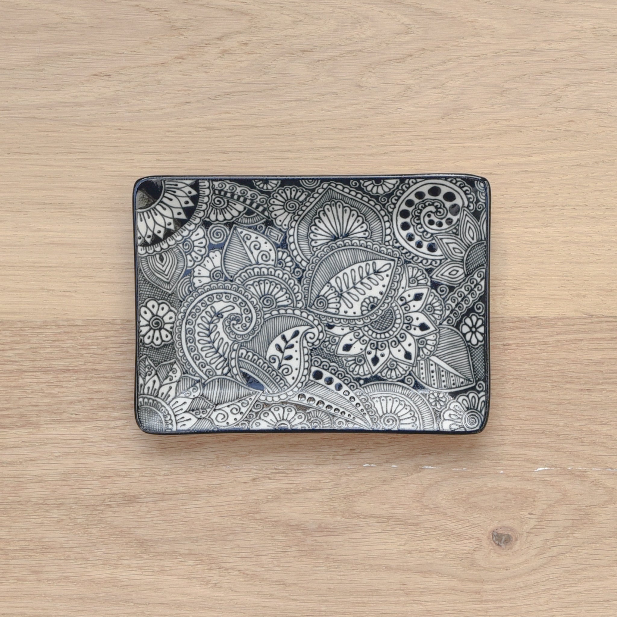 Handpainted Talavera-style ceramic tray in modern, black and white colors.