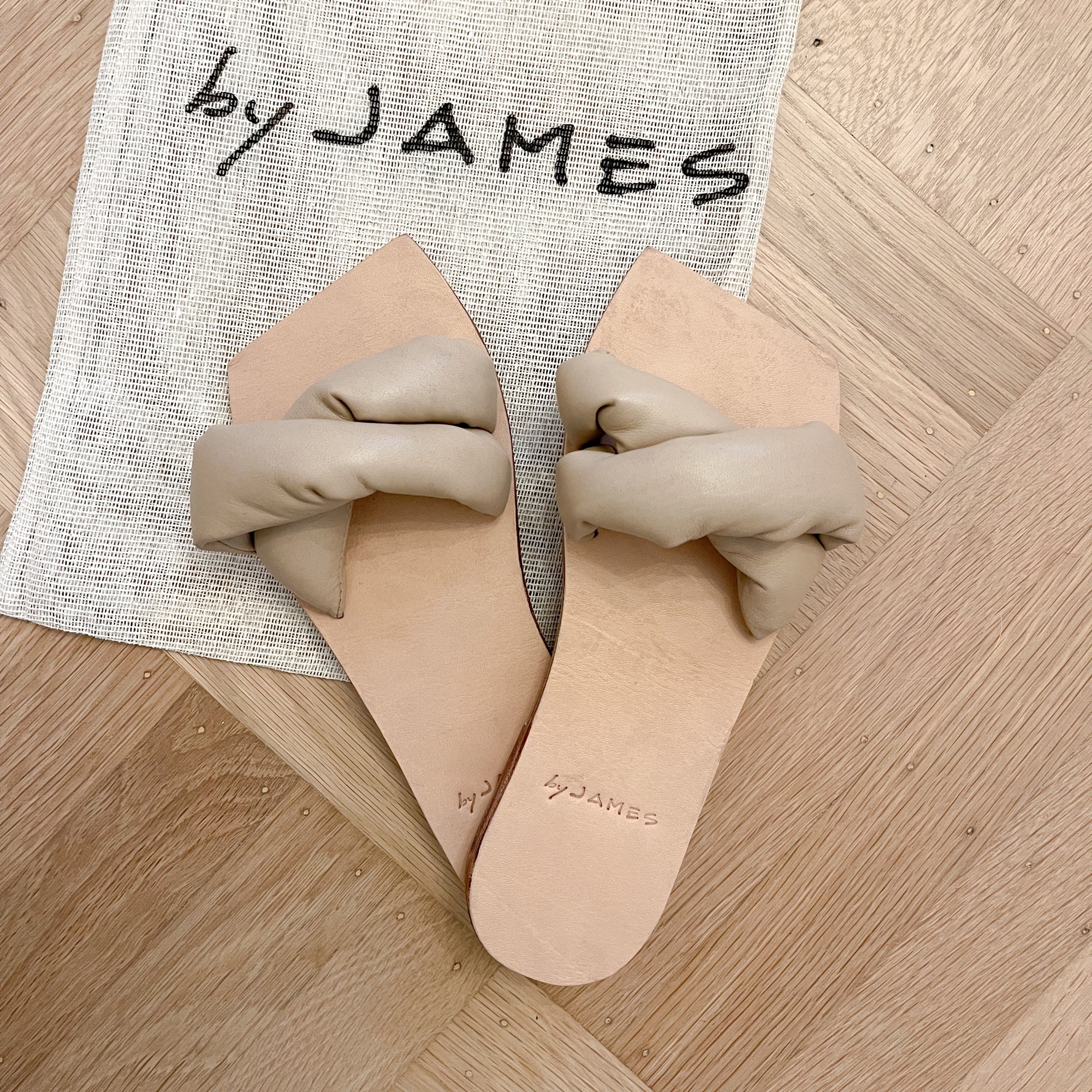 Nude padded leather sandals with square cut toe.