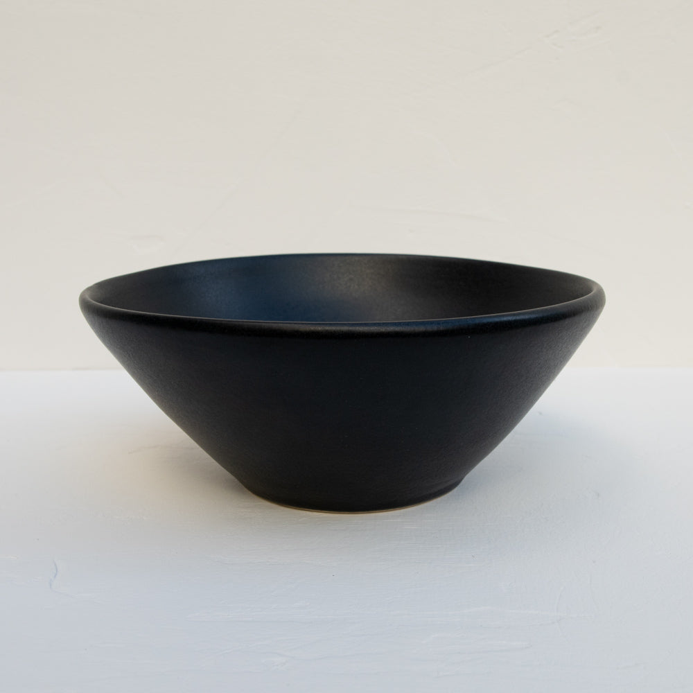 The Artesanal matte-black stoneware serving bowl. 