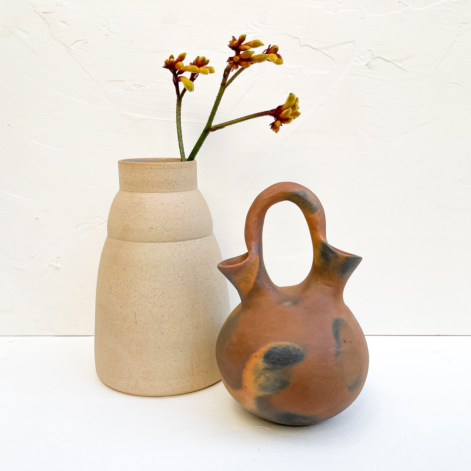 A pair of Mexican-made ceramic vases.