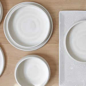 White stoneware dishes including a salad plate and bowl.