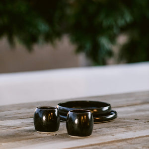 Yunomi negro clay cups on a table.